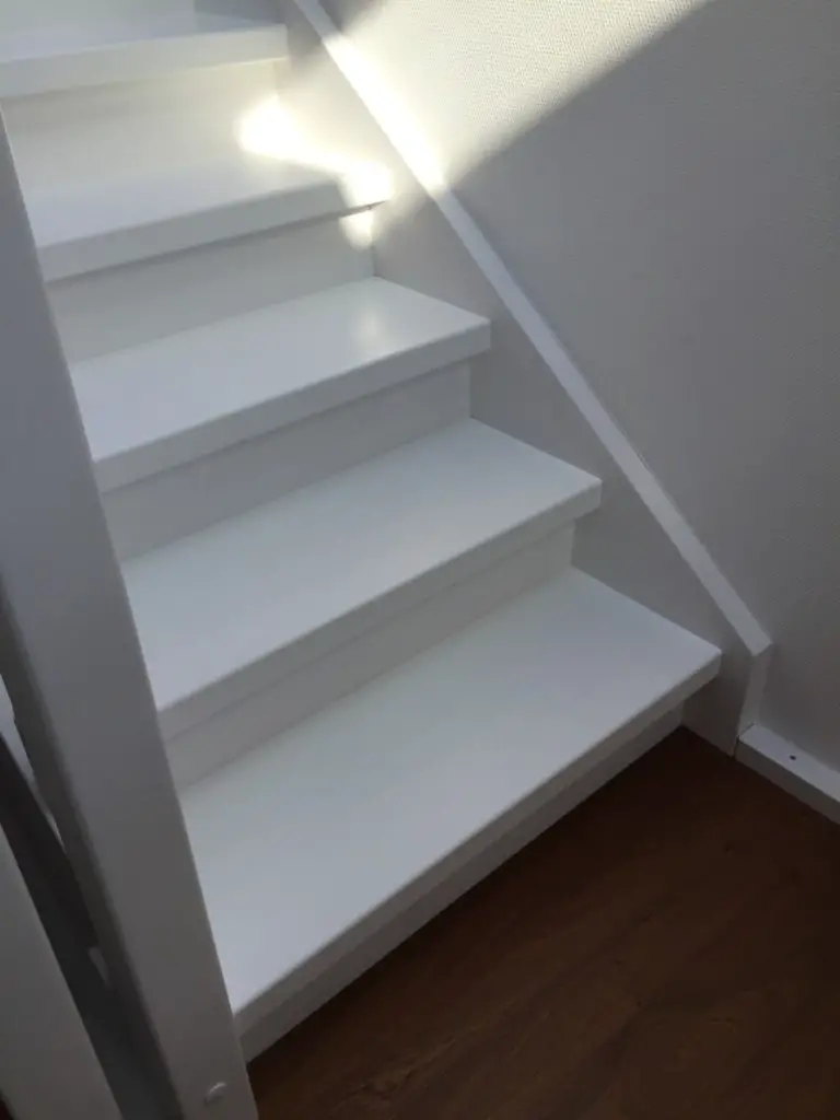 A White Corian Staircase style | stair materials | modern stair banister ideas | wood and glass staircase