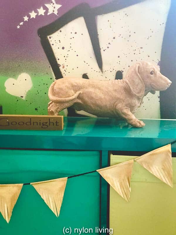 We’ve had a difficult time finding teen girl bedroom furniture and so we’ve gone with Ikea with designer accessories like this daschund piggy bank from Atelier Abigail Ahern