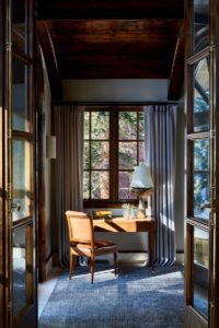 desk and chair with walls of glass