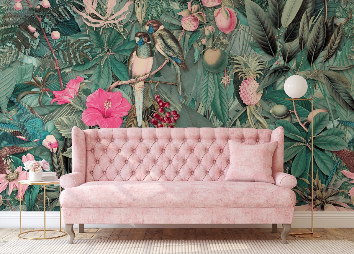 pink sofa against whimsical jungle mural with tropical flower and birds.